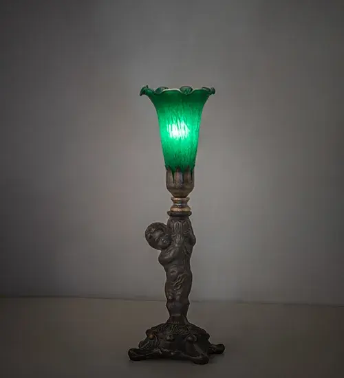 Recreating the famous Tiffany design from the early 1900s. This mini lamp features a stunning shade mouth blown of Green Favrile-style art glass. The Pond Lily shade is embraced by an elegant cast metal base featuring a charming cherub finished by hand in Antique Brass. This lamp is ideal for illuminating picture windows; credenzas; and desktops in fine homes and hotels from Buffalo-Cheektowaga; New York; to the Providence-Warwick; Rhode Island region. The Pond Lily Mini Lamp is included in our American-designed; handcrafted Favrile Glass Collection. UL and cUL listed for dry locations. Each shade is a unique work of art with color variations based on natural ingredients inherent in the glass.