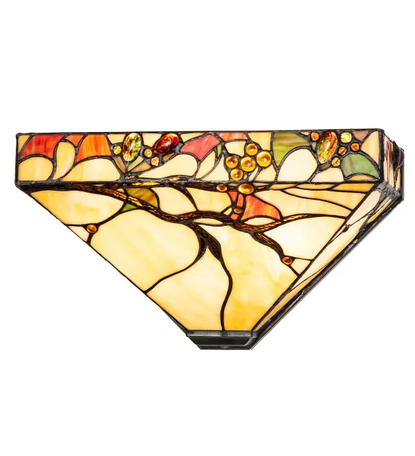 This eye-catching American artistic design is defined by Beige art glass highlighted with Bark Brown tree branches that are almost bare after shedding their foliage of leaves in Green; Red; and Sunburst; which are accented with Burgundy Swirl and Gold glass jeweled berries. The inverted shade features authentic art glass pieces set into the finely detailed design and copperfoiled using Meyda's famous construction process. This stunning lighting design is inspired by natural foliage from the Bridger-Teton National Forest in Wyoming; the Beaverhead-Deerlodge National Forest in Montana; and the Salmon-Challis National Forest in Idaho. The wall sconce is perfect for hallways and dining spaces in residential and hospitality locations.?The Woodland Berries Wall Sconce is featured in our American-designed; handcrafted Tiffany Reproduction Stained Glass Lighting Collection. UL and cUL listed for dry and damp locations. Each shade is a unique work of art with color variations based on natural ingredients inherent in the glass.