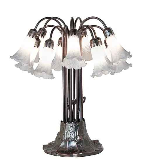 Recreating the famous Tiffany design from the early 1900s. This resplendent table lamp features 12 stunning shades created of Gray Favrile-style art glass. An elegant metal base with floral accents is finished by hand in Mahogany Bronze. This lamp is ideal for illuminating picture windows; dining areas; and living spaces in fine homes and hotels from Cheektowaga; New York; to Warwick; Rhode Island. The Gray Tiffany Pond Lily 12 Light Table Lamp is featured in our American-designed; handcrafted Favrile Glass Lighting Collection. UL and cUL listed for dry locations. Each shade is a unique work of art with color variations based on natural ingredients inherent in the glass. - alternate view