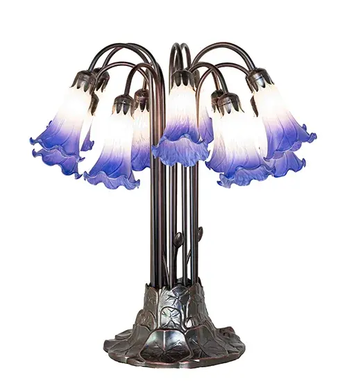 Recreating the famous Tiffany design from the early 1900s. This resplendent table lamp features 12 stunning shades created of Blue and White Favrile-style art glass. An elegant metal base with floral accents is finished by hand in Mahogany Bronze. This lamp is ideal for illuminating picture windows; dining areas; and living spaces in fine homes and hotels from Cheektowaga; New York; to Warwick; Rhode Island. The Blue/White Tiffany Pond Lily 12 Light Table Lamp is included in our American-designed; handcrafted Favrile Glass Lighting Collection. UL and cUL listed for dry locations. Each shade is a unique work of art with color variations based on natural ingredients inherent in the glass. - alternate view