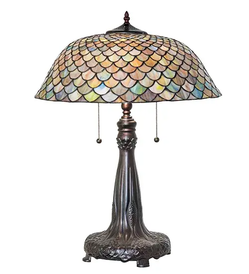 A Louis Comfort Tiffany studio classic... The renowned Fishscale design features a variegated Tortoiseshell of Emerald; Sapphire; Mauve; and Beige colored art glass; evoking a unique dimensional and textured look in a rainbow of brilliant hues. This exquisite art glass shade is created using the famous Meyda Tiffany copperfoil construction process and complemented with an elegant cast metal base featuring a Mahogany Bronze finish. The lamp design was inspired by Rainbow Trout and other colorful fish found in Northwest Montana; Eastern Idaho; and Baja; California. The lamp is perfect for illuminating picture windows; occasional tables; office desks; and other spaces. The Tiffany Fishscale Table Lamp is included in our American-designed; handcrafted Tiffany Reproduction Lighting Collection. UL and cUL listed for dry locations. Each shade is a unique work of art with color variations based on natural ingredients inherent in the glass. - alternate view