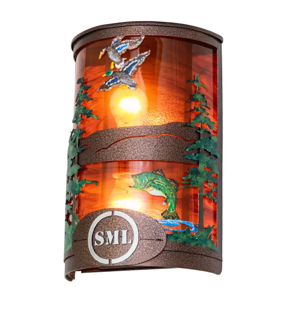 The call of the wild comes to light; with Bass leaping out of a mountain lake below while Mallard Ducks are soaring high towards the heavens above the Tall Pine woodlands as the morning sun rises in the background. The lighting design is personalized with the monograms; SML. Beautiful ambient light shines through a Maduro Idalight lens while the shade is enhanced with Green and Blue finished accents and hardware featured in a New Copper Vein finish. The ADA-Compliant wall piece for illuminating a dining area or foyer in residential; hospitality; and commercial spaces throughout the US; including Henderson; Nevada; to Helena; Montana; to Everett; Washington. The Personalized Bass & Mallard Wall Sconces are featured in our American-made; American-designed; handcrafted Wildlife Lighting Collection. This fixture is manufactured in Yorkville; New York. UL and cUL listed for dry and damp locations. Upstate New York's adventurous playland; known as the Adirondack Mountains; with its many breathtaking forests; lakes; and rivers; is the spiritual birthplace of Meyda and inspires our rustic-themed collections. See the complementary 8 Wide Personalized Bass & Mallard Right Wall Sconce (273933). Call us today; and we will add your monograms or name to a lighting fixture for your next project."