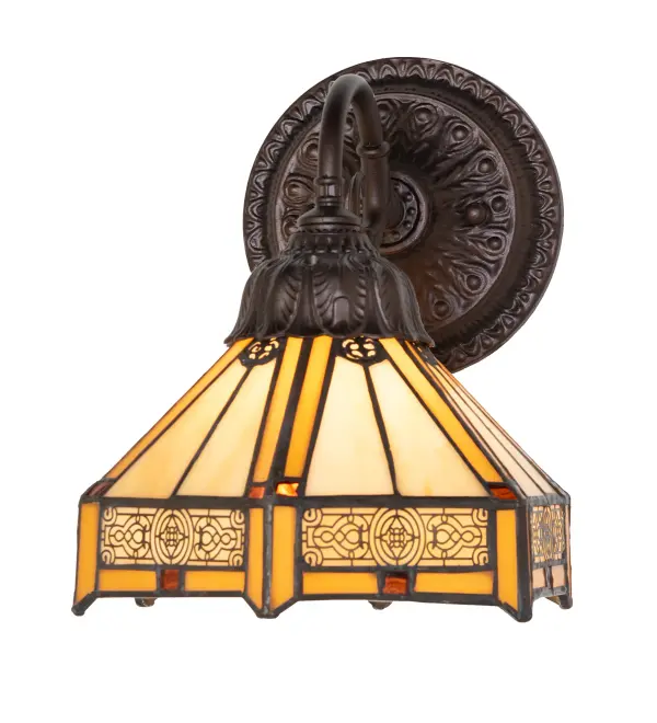The Peaches Wall Sconce features Honey-colored stained glass strips accenting the Beige panels of this hexagonal-shaped shade, highlighted with Brass Filigree Accents on the shade's skirt. The small square pieces of glass feature Sunburst and Amber accents. The elegant cast metal hardware is designed and manufactured in Yorkville, New York. The beautiful stained glass shade is designed by Meyda artisans, created using the famous Meyda Tiffany construction process, and artfully crafted by our partner studios across the globe. The wall fixture is ideal for illuminating dining rooms and hallways in homes and hotels from Macon, Georgia, to Fresno, California. The Peaches Wall Sconce is featured in our handcrafted Stained Glass Lighting Collection. The fixture is UL and cUL listed for dry and damp locations. Each shade is a unique work of art with color variations based on natural ingredients inherent in the glass. Collection: Peaches Finish: Mahogany Bronze Glass: Stained Glass Width: 8.00" Height: 10.00" Length: 8.00" Weight: 4.00 lb Number of Bulbs: 1 Maximum Wattage: 60.00 W Bulb Type: A19 Bulb Base: E26 Material: Steel Country of Origin: CHINA Safety Rating: Damp