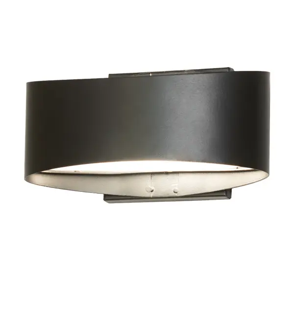 A curvaceous modern wall sconce with a dapper style, this sleek, stylish design features a Textured Black finish that wraps around a Contrail Mist Idalight lens for downlighting on surfaces below. Designed with style and functionality in mind, its sophisticated design and high-quality materials make it a standout addition to any room. The striking wall fixture is perfect for fine interiors in homes from Cincinnati, Ohio, St. Paul, Minnesota, to Stockton, California. The Envolver Wall Sconce is included in our American-made, American-designed, handcrafted Modern Lighting Collection, which is manufactured in Yorkville, New York. It is UL and cUL listed for dry and damp locations. Collection: Envolver Finish: Textured Black Glass: Contrail Mist Idalight Width: 9.00" Height: 4.00" Length: 5.00" Weight: 1.50 lb Number of Bulbs: 1 Maximum Wattage: 25.00 W Bulb Type: T4 Bulb Base: G9 Material: Steel Country of Origin: USA Safety Rating: Damp