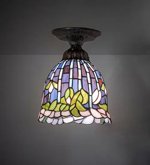 Inspired by Tiffany Studios' highly sought-after Flowering Lotus lamp; one of the world's foremost stained glass designs... This exquisite shade was crafted using quality hand-cut art glass and the famous Meyda Tiffany copperfoil techniques and embraced by Mahogany Bronze finished hardware. Blossoming Leafy Green; Yellow; Red; and Pink petals are highlighted with Green Stained Glass stems on a Multicolored background. This shade recaptures the artistry and craftsmanship perfected by Tiffany in his original creations. This piece is crafted by our most highly trained artisan; who hand-selected each piece of glass with impeccable taste for picking the correct movement so the grain is seamless and soldering is high caliber. This masterful art glass shade is ideal for illuminating hallways and living spaces in fine homes and hotels. The overall height can be adjusted by combining the four stem lengths that are included: 6-inch; 12-inch; 16-inch; and 24-inch; in any combination to achieve the desired drop from the ceiling. The Tiffany Flowering Lotus Flushmount is included in our American-designed; handcrafted Tiffany Museum Reproduction Collection. Each shade is a unique work of art with color variations based on natural ingredients inherent in the glass.