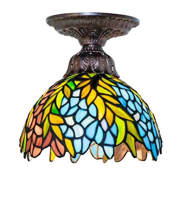 The Honey Locust is a popular floral design created by Louis Comfort Tiffany over a century ago. The ceiling fixture features a decorative; dome-shaped stained glass shade with petal-shaped edges; depicting clusters of Plum and Periwinkle flowers amid Spring Green leaves cascading downward. This fixture is designed with elegant cast metal hardware finished in Mahogany Bronze. It is ideal for illuminating hallways; dining areas; and other spaces in homes; restaurants; and inns. The Tiffany Honey Locust Flushmount is included in our American-designed; handcrafted Tiffany Stained Glass Collection. UL and cUL listed for dry and damp locations. Each shade is a unique work of art with color variations based on natural ingredients inherent in the glass.