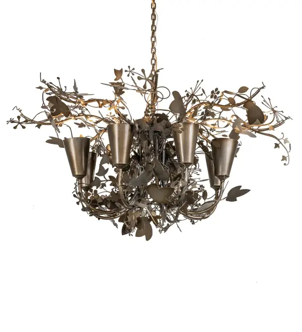Exquisite, delicate metal leaves, flowers, and branches appear to dance joyfully among the light as the rustic charm is revealed with this Nature-inspired chandelier. Antique Hammer Gold finished Oak Leaf and Flower accents flourish from branch-like arms that adorn eight complementary inverted shades. This elaborate fixture is ideal for illuminating entryways, ballrooms, lobbies, and any room where you want to make a design statement. The overall height ranges from 24 to 61 inches, as the chain length can be easily adjusted on location to meet your lighting specifications. The Lau Lau 8 Light Chandelier is included in our American-made, American-designed, handcrafted Nature Inspired Lighting Collection and manufactured in Yorkville, New York. The fixture is UL and cUL listed for dry and damp locations. Upstate New York's adventurous playland, known as the Adirondack Mountains, with its many breathtaking forests, lakes, and rivers, is the spiritual birthplace of Meyda and inspires our rustic-themed collections. Collection: Lau Lau Finish: Antique Hammer Gold Width: 48.00" Height: 24.00" Length: 48.00" Weight: 40.00 lb Number of Bulbs: 8 Maximum Wattage: 60.00 W Bulb Type: A19 Bulb Base: E26 Material: Steel Country of Origin: USA Safety Rating: Damp