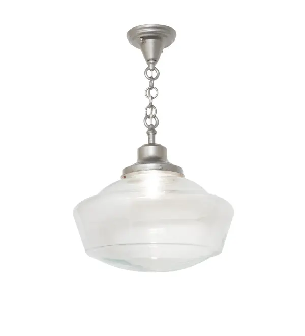 Restore the past with this appealing ceiling fixture; featuring a beautifully formed Clear Glass shade with a traditional globe profile; complemented by a Light Sandstone finish. This vintage-style shade offers a refined yet consistent; distinctive design that originated in traditional schoolhouses and public buildings in the early 1920s. The pendant is ideal for dining spaces; corridors; and other public areas in homes; restaurants; and other public spaces. The overall height ranges from 23 to 26 inches; and the chain can be easily adjusted on location. The Revival Traditional Globe Pendant is included in our American-designed; handcrafted Schoolhouse Lighting Collection. The fixture is UL and cUL listed for use in dry and damp locations.