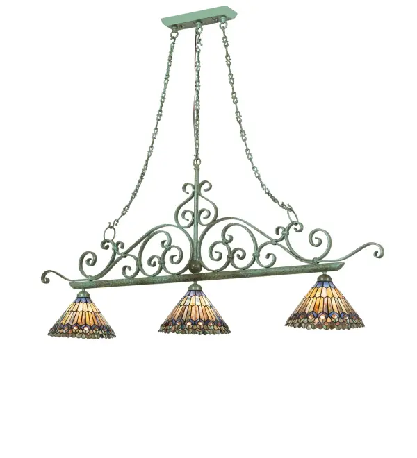 As distinctive as beautiful Peacock fanning feathers in the wild, no two shades will ever be the same. Their individuality can be as remarkably unique as their personality in this three-light pendant. This artistic creation uses art glass background combinations, including Beige, Yellow Pinks, Golden Greens, Ivory, Bluish Whites, Turquoise Blues, Olive, and Spring Greens. The eye of the plumage design reveals Purples, Pastel Blues, Teals, Cobalt, and Ivory, accented with Blue- and Purple- colored jewels. Three exquisite stained-glass shades are crafted using the famous Meyda Tiffany copper-foil construction technique. The fixture is ideal for illuminating bars, islands, and tables and is enhanced with scrollwork and hardware in a Tarnished Copper finish. The Tiffany Jeweled Peacock 3 Light Island Pendant is featured in our American-designed, handcrafted Tiffany Reproduction Collection. UL and cUL listed for dry and damp locations. Each shade is a unique work of art, with color variations reflecting the natural ingredients inherent in the glass. Collection: Tiffany Jeweled Peacock Finish: Tarnished Copper Glass: Stained Glass Width: 12.00" Height: 55.00" Length: 68.00" Weight: 44.00 lb Number of Bulbs: 3 Maximum Wattage: 60.00 W Bulb Type: A19 Bulb Base: E26 Material: Steel Country of Origin: USA Safety Rating: Damp