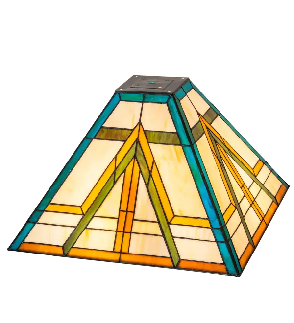 In the tradition of the Prairie School; organic objects were interpreted into geometric forms. Meyda Tiffany uses colorful interlocking blocks and diagonal shapes of Willow Green; Sunrise Amber and Teal glass on a Beige Cream background. The stained glass shade is created using the famous Meyda Tiffany copperfoil construction and can be paired with an architectural-styled base. The Moab Shade is featured in our American-designed; handcrafted Mission Lighting Collection. Custom made. Call for pricing and lead time. This shade is featured on a table lamp at Colusa Casino Resort in Colusa; California.