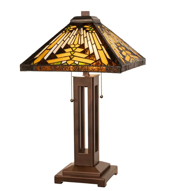Like gazing out your window across the warm desert at sunset, interlocking tiles of Sand tone Beige glow behind the sun, glistening Orange, Amber Green, and Brown rays. A Root Brown border surrounds all this. The stunning Nuevo Mission table lamp features a stained glass shade created using the famous Meyda Tiffany copperfoil construction method and embraced with a Mahogany Bronze finished lamp base offered in a handsome Mission style. The Nuevo Mission Table Lamp is featured in our American-designed, handmade Southwestern Stained Glass Series. The lamp is UL and cUL listed for dry locations. Each shade is a unique work of art with color variations based on natural ingredients inherent in the glass. Collection: Nuevo Finish: Mahogany Bronze Glass: Stained Glass Width: 14.00" Height: 24.00" Length: 14.00" Weight: 15.00 lb Number of Bulbs: 2 Maximum Wattage: 60.00 W Bulb Type: A19 Bulb Base: E26 Material: Steel Country of Origin: CHINA Safety Rating: Dry