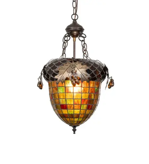As majestic as the mighty Oak is this Leaf-adorned inverted pendant. A lighted art glass Acorn in Multicolored Autumn colors features a Bark Brown Granite Glass crown sprouting metal Oak Leaves. The stunning shade is complemented with an Antique Copper finish. The ceiling pendant is ideal for placement in living rooms; lobbies; and entryways in residential and hospital settings. The overall height of this pendant ranges from 27 to 62 inches; as the chain length can be easily adjusted on location to accommodate your specific lighting application needs. The Acorn & Oak Leaf Pendant is included in our American-made; American-designed; handcrafted Nature Inspired Stained Glass Lighting Collection and is manufactured in Yorkville; New York. UL and cUL listed for dry and damp locations. Upstate New York's adventurous playland; known as the Adirondack Mountains; with its many breathtaking forests; lakes; and rivers; is the spiritual birthplace of Meyda and inspires our rustic-themed stained glass collections. - alternate view