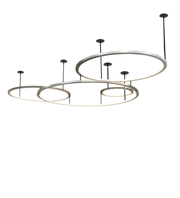 Anillo is a massive; modern; sophisticated system featuring extraordinary adjustable elements of ambient light. Our spectral halos appear to rotate; creating a stunning visual effect and breathtaking drama. This custom-configurable grouping of Brushed Stainless Steel-finished solid rings reveals Statuario Idalight diffusers and is complemented with Solar Black canopies and suspension rods. High-powered; integral LEDs deliver dimmable; robust illumination; energy savings; minimal maintenance; and long life. These eye-catching rings emit a clean glow and enhance the ambiance of the surrounding space; elevating the fixture's appeal in homes; resorts; and hotels. The Anillo Cascading Pendant is included in our American-made; American-designed; handmade Modern Lighting Collection and manufactured in Yorkville; New York. UL and cUL listed for dry and damp locations. This fixture was designed by David Singer of Arc Light Design in New York for a private residence in Texas.