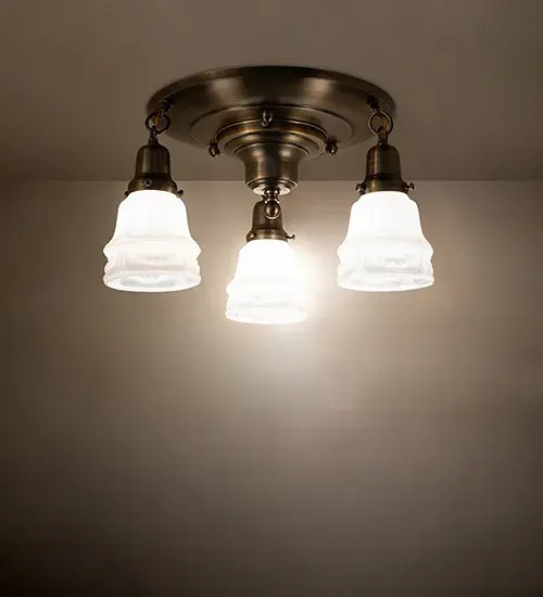 Inspired by a famous Revival lighting design from the early 1900s... This Brass ceiling fixture is created with three mouth blown shades featuring White Art Glass. The decorative shades are embraced by elegant cast metal hardware featuring a Brushed Brass finish. The Revival Garland 3 Light Flushmount is featured in our American Made; American designed; handcrafted Revival Lighting Collection. Manufactured in Yorkville; NY. UL and cUL listed for dry and damp locations. Each shade is a unique work of art with color variations based on natural ingredients inherent in the glass.