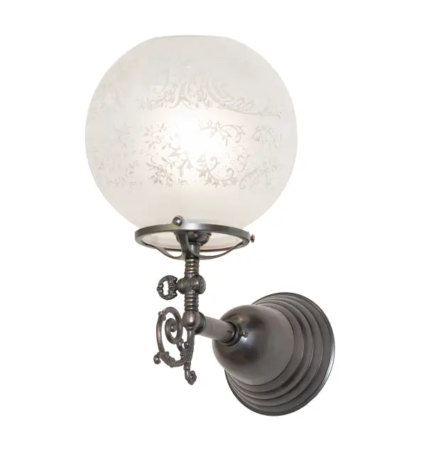 Step back in time with an elegant Brass wall sconce featuring a traditional globe-style glass shade; fit; and finish. Reminiscent of lighting fixtures from the early 1900s; the Clear Etched Revival Glass shade features an authentic historic look to complement any room or space. Weathered Antique Brass finished hardware; accents; and a traditional on/off paddle switch make this piece a timeless treasure. This stunning wall fixture is perfect for placement in corridors and dining areas in residential and hospitality settings. The Revival Gas & Electric Wall Sconce is included in our American-designed; handcrafted Revival Lighting Collection. It is UL and cUL listed for dry and damp locations.