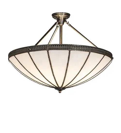 Invite rich Gothic beauty and luxurious charm into any home; hotel; restaurant; retail; or commercial space with this classic ceiling fixture. Created with Brass and Glass; this elegant ceiling fixture features Brass beaded filigree accenting the decorative trim. White art glass panels are high-fired and curved into an alluring profile. The shade is trimmed with decorative accents in an Antique Brass finish to coordinate with the matching frame and hardware. The fixture is ideal for installation in dining areas and entryways in fine homes; restaurants; and hotels. The Shansky Semi-Flush Mount is included in our American-made; American-designed; handcrafted Traditional Lighting Collection and manufactured in Yorkville; New York. The fixture is UL and cUL listed for dry and damp locations. - alternate view