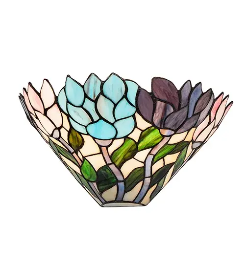 Stylized wisteria flower clusters of China Pink; Grape and Amethyst Blue with Jade Green leaves drape over this Ivory toned graceful copper foil wall sconce shade. The classic styling of this Tiffany style stained glass fixture and soft pastel colors will add charm to any room. - alternate view