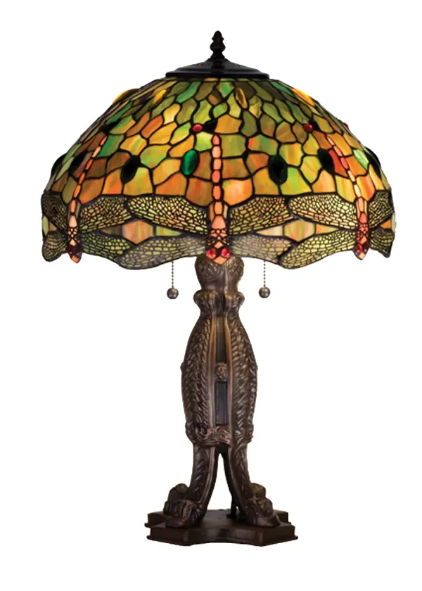 This version of Tiffany Studio's most beloved stained glass dragonfly design, is modeled after the original hanging head dragonfly. Diving dragonflies with glowing Scarlet jeweled eyes and delicate metal filigree wings circle over hand cut and copper foiled pieces of Amber, Pond Green and Scarlet art glass and glistening jewels of Amber, Emerald and Scarlet that represent sunset reflections on rippling water. The table lamp base is finished in a warm hand applied Mahogany Bronze. Collection: Tiffany Hanginghead Dragonfly Finish: Mahogany Bronze Glass: Stained Glass Width: 17.00" Height: 24.50" Length: 17.00" Weight: 12.00 lb Number of Bulbs: 2 Maximum Wattage: 60.00 W Bulb Type: A19 Bulb Base: E26 Material: Polyresin Country of Origin: CHINA Safety Listing: Dry Safety Rating: Dry