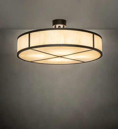 This ceiling fixture features a Sahara Taupe Idalight shade with a matching bottom diffuser and a cross style design. Hardware is finished in Statuary Bronze Metallic. Ideal for hallways; entryways; and residential and hospitality spaces. Included in our American-made; American-designed; handcrafted Transitional Lighting Collection and manufactured in Yorkville; New York. UL and cUL listed for dry and damp locations.