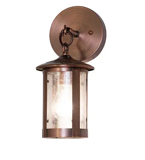 Handcrafted of Solid Copper with exquisite beauty for both interior and outdoor lighting applications. This stunning cylindrical lantern features a Clear Seeded Glass lens, revealing a single Edison-style lamp enhanced with an Antique Copper finish. The wall sconce is perfect for illuminating outdoor walls and facades in timber homes, modern farmhouses, and other spaces. The Fulton Prime Wall Sconce is part of our American-made, American-designed, handcrafted Craftsman Signature Series, manufactured in Yorkville, New York. UL and cUL are listed for use in both dry and damp locations. Our Build Your Own Craftsman Signature Series features unlimited combinations of styles. The collection is called Build Your Own because it is fully configurable and customizable from size and design to finish and lens color. Marine-grade, solid brass, or copper raw materials are utilized to ensure items from the Craftsman Signature Series of outdoor and indoor lighting will stand the test of time, as these premium metals are impervious to most types of oxidation. Hand-applied Patina finishes on brass and copper are sealed with a clear varnish and, over time, may require gentle maintenance, such as wax, to delay or reverse the natural living finish attributes indicative of this finishing process. Patina finishes on brass and copper provide strong resistance to fading from sun exposure, will not chip or crack, and will not rust like a steel-framed item in the same conditions. Choose from a variety of style options, or send us your concept today! Call today to learn how to use the configuration tool available on our website to instantly generate an item number. Collection: Fulton Finish: Antique Copper Glass: Clear Seeded Glass Width: 5.00" Height: 12.00" Length: 6.00" Weight: 2.50 lb Number of Bulbs: 1 Maximum Wattage: 9.00 W Bulb Type: A19 Bulb Base: E26 Light Source: LED Material: Copper Country of Origin: USA Safety Rating: Wet LED - alternate view