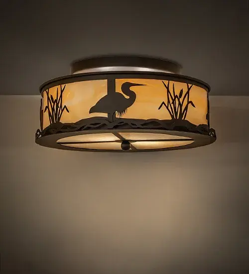 The Heron is recognized for its calm; stability; and fluidity; and this stunning fixture features the long-necked wading bird with a solid profile; finished in Oil-Rubbed Bronze. The delicate design is highlighted by a stunning Beige Art Glass lens. The fixture is ideal for illuminating hallways and dining areas in residential and hospitality locations. The Heron Flush Mount is featured in our American-made; American-designed; handcrafted Wildlife Collection and is manufactured in Yorkville; New York. UL and cUL listed for dry and damp locations.