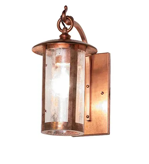 Handcrafted of Solid Copper with exquisite beauty for both interior and outdoor lighting applications. This stunning cylindrical lantern features a Clear Seeded Glass lens, revealing a single Edison-style lamp enhanced with a Raw Copper finish. The wall sconce is perfect for illuminating outdoor walls and facades in timber homes, modern farmhouses, and other spaces. The Fulton Prime Wall Sconce is part of our American-made, American-designed, handcrafted Craftsman Signature Series, manufactured in Yorkville, New York. UL and cUL are listed for use in both dry and damp locations. Our Build Your Own Craftsman Signature Series features unlimited combinations of styles. The collection is called Build Your Own because it is fully configurable and customizable from size and design to finish and lens color. Marine-grade, solid brass, or copper raw materials are utilized to ensure items from the Craftsman Signature Series of outdoor and indoor lighting will stand the test of time, as these premium metals are impervious to most types of oxidation. Hand-applied Patina finishes on brass and copper are sealed with a clear varnish and, over time, may require gentle maintenance, such as wax, to delay or reverse the natural living finish attributes indicative of this finishing process. Patina finishes on brass and copper provide strong resistance to fading from sun exposure, will not chip or crack, and will not rust like a steel-framed item in the same conditions. Choose from a variety of style options, or send us your concept today! Call today to learn how to use the configuration tool available on our website to generate an item number instantly. Collection: Fulton Finish: Raw Copper Glass: Clear Seeded Glass Width: 6.00" Height: 13.00" Length: 9.50" Weight: 3.00 lb Number of Bulbs: 1 Maximum Wattage: 60.00 W Bulb Type: A19 Bulb Base: E26 Material: Steel Country of Origin: USA Safety Rating: Wet - alternate view