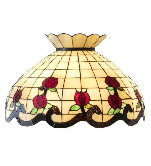 Grace your home with the elegant Roseborder shade. This exquisitely crowned shade features a gridwork of Beige art glass adorned with a Bark Brown border of swirling ribbons and perfect Red Rosebuds with Green Leaf accents. The art glass shade is made of hand cut glass using the famous Meyda Tiffany copperfoil construction process. The lovely shade can be paired with a base to create a stunning table or floor lamp or matched with hardware to create a beautiful ceiling fixture. Each shade is a unique work of art with color variations based on natural ingredients inherent in the glass. Contact us if color matching is critical when ordering multiple items.