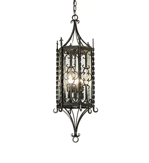 A touch of warm opulence is blended with elegant Hand-Forged Iron Scrolled Metalwork; creating a stunning look. This exquisite ceiling pendant features a lovely style; showcasing a Clear Seeded Glass lens that reveals three faux candle lights and is enhanced with a Crystal Idalight bottom diffuser. The fixture is complemented by an Exterior Oil-Rubbed Bronze finish. It is ideal for providing ambient illumination in the interiors and exteriors of residential and hospitality locations. The overall height ranges from 37 to 156 inches; as the chain can be easily adjusted on location to meet your specific lighting requirements. The Cosette Pendant is featured in our American-made; American-designed; handcrafted Gothic Lighting Collection; manufactured in Yorkville; New York. It is UL and cUL listed for dry; damp; and wet locations. - alternate view