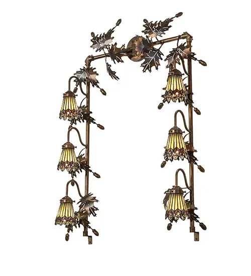 As distinctive as beautiful Peacock fanning feathers in the wild; no two shades will ever be the same. Their individuality can be as remarkably unique as their personality in this six-light pendant. This artistic creation uses art glass background combinations; including Beige; Yellow Pinks; Golden Greens; Ivory; Bluish Whites; Turquoise Blues; Olive; and Spring Greens. The eye of the plumage design reveals Purples; Pastel Blues; Teals; Cobalt; and Ivory; accented with Blue- and Purple- colored jewels. Six exquisite stained-glass shades are crafted using the famous Meyda Tiffany copper-foil construction technique. The fixture is ideal for illuminating vanities in fine baths and is enhanced with two dozen exquisite metal Oak Leaves; Acorns and hardware finished in Dark Burnished Antique Copper. The Tiffany Jeweled Peacock 6 Light Vanity Light is featured in our American-designed; handcrafted Tiffany Reproduction Collection. UL and cUL listed for dry and damp locations. Each shade is a unique work of art; with color variations reflecting the natural ingredients inherent in the glass. - alternate view