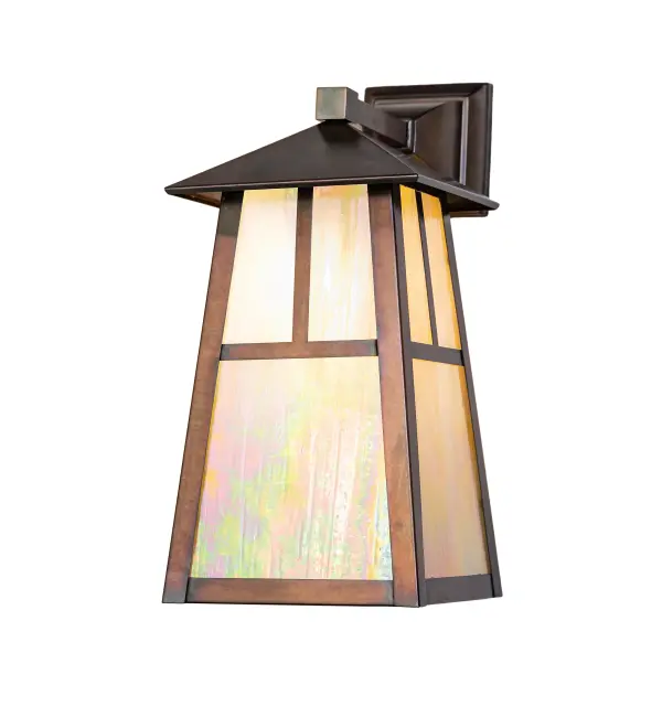Handcrafted from Solid Brass, this handsome Craftsman-style Brass wall sconce is inspired by the Arts and Crafts movement. The minimalistic T Mission design is featured on a Beige Iridescent Glass lens, with a frame and hardware finished in Weathered Antique Brass. The fixture is ideal for illuminating the interiors and exteriors of timber homes, modern farmhouses, and other spaces. The Stillwater T" Mission Wall Sconce is included in our American-made, American- designed, handcrafted Craftsman Signature Series and manufactured in Yorkville, New York. UL and cUL listed for dry, damp, and wet locations. Our Build Your Own Craftsman Signature Series features unlimited combinations of styles. The collection is called Build Your Own because it is fully configurable and customizable from size and design to finish and lens color. Marine- grade, solid brass, or copper raw materials are used to ensure that items from the Craftsman Signature Series of outdoor and indoor lighting will stand the test of time, as these premium metals are impervious to most forms of oxidation. Hand-applied Patina finishes on brass and copper are sealed with a clear varnish and, over time, may require gentle maintenance, such as wax, to delay or reverse the natural living finish attributes indicative of this finishing process. Patina finishes on brass and copper provide strong resistance to fading from sun exposure, will not chip or crack, and will not rust like a steel-framed item in the same conditions. Choose from many style options, or send us your concept today! Call today to learn how to use our website's configuration tool to get an instant item number! " Collection: Stillwater Finish: Weathered Antique Brass Glass: Beige Iridescent Glass Width: 8.00" Height: 17.00" Length: 12.00" Weight: 7.50 lb Number of Bulbs: 1 Maximum Wattage: 60.00 W Bulb Type: A19 Bulb Base: E26 Material: Brass Country of Origin: USA Safety Rating: Wet