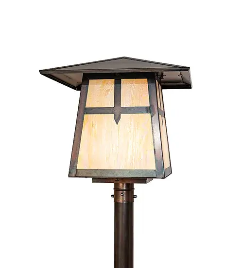 Constructed from Solid Brass, this post mount fixture makes a stunning Craftsman-style statement, captured in a dramatic profile and featuring a unique Cross Mission design. The fixture includes both the post and the post top for mounting on decks, patios, and porches while providing beautiful ambient lighting in timber homes, modern farmhouses, and other spaces. The Beige Iridescent Glass diffuser is enhanced with a frame and hardware finished in Weathered Antique Brass. The Stillwater Cross Mission Post Mount is part of our American-made, American-designed, handcrafted Craftsman Signature Series, manufactured in Yorkville, New York. The fixture is UL and cUL listed for use in dry, damp, and wet locations. Our Build Your Own Craftsman Signature Series features unlimited combinations of styles. The collection is called Build Your Own because it is fully configurable and customizable from size and design to finish and lens color. Marine-grade, solid brass, or copper raw materials are utilized to ensure items from the Craftsman Signature Series of outdoor and indoor lighting will stand the test of time, as these premium metals are impervious to most types of oxidation. Hand-applied Patina finishes on brass and copper are sealed with a clear varnish and, over time, may require gentle maintenance, such as wax, to delay or reverse the natural living finish attributes indicative of this finishing process. Patina finishes on brass and copper provide strong resistance to fading from sun exposure, will not chip or crack, and will not rust like a steel-framed item in the same conditions. Mica is less durable in outdoor locations but may be appropriate for mildly exposed areas. Choose from many style options or send us your concept today! Call today to learn how to use the configuration tool available on our website to generate an item number instantly. Collection: Stillwater Finish: Weathered Antique Brass Weathered Antique Brass Glass: Beige Iridescent Glass Width: 28.50" Height: 71.00" Length: 20.00" Weight: 40.00 lb Number of Bulbs: 1 Maximum Wattage: 60.00 W Bulb Type: A19 Bulb Base: E26 Material: Brass/Steel Country of Origin: USA Safety Rating: Wet - alternate view
