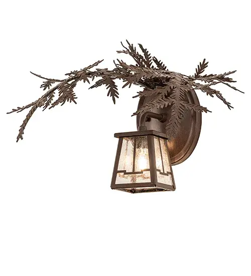 Enjoy the natural beauty of the American woodlands with this stunning wall luminaire. The solid hardware features decorative metal branches and pine needles in a Cafe Noir finish. A charming lantern showcases a lovely Clear Seeded Glass lens. The fixture can be used as a wall sconce in a hallway and other rooms in lodges, camps, and other residential and hospitality locations. The Pine Branch Valley View Wall Sconce is included in our American-made, American-designed, handcrafted Nature Inspired Collection and manufactured in Yorkville, New York. UL and cUL listed for dry and damp locations. Collection: Pine Branch Finish: Cafe Noir Glass: Clear Seeded Glass Width: 16.00" Height: 11.00" Length: 12.00" Weight: 2.50 lb Number of Bulbs: 1 Maximum Wattage: 60.00 W Bulb Type: JCD Bulb Base: G9 Material: Steel Country of Origin: USA Safety Rating: Damp - alternate view