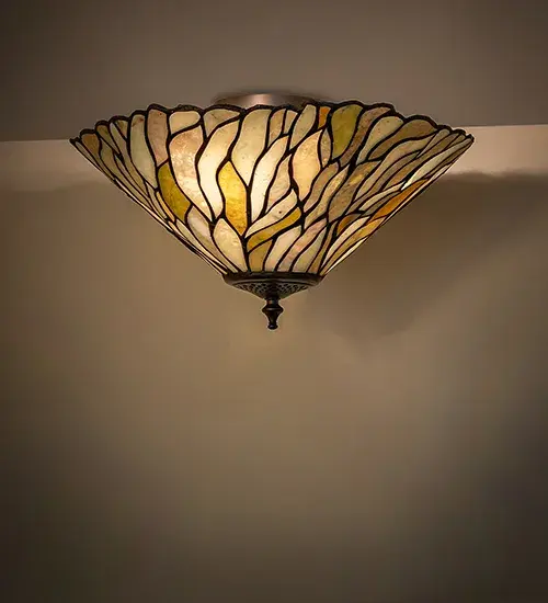 Thinly carved and polished Natural Jadestone in earthy tones of Moss Green and Ivory becomes luminescent in this wispy Willow leaf-patterned shade. This stunning Jadestone shade is created using the famous Meyda Tiffany copper foil construction technique and enhanced with a Mahogany Bronze finish. This ceiling fixture is ideal for illuminating hallways; dining rooms; and areas in residential and hospitality spaces. The Willow Jadestone Flush Mount is featured in our American-designed; handcrafted Jadestone Lighting Collection. The fixture is UL and cUL listed for dry and damp locations. Each shade is a unique work of art with color variations based on natural ingredients inherent in the Jadestone.