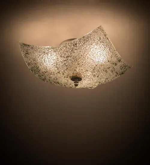 Designed like the fascinating surface of the Moon; this Fused Glass shade features textured slumped glass in Pale Gray and Clear glass colorations. The Art Glass shade is fused and formed in a hot kiln by Meyda artists and craftsmen. This ceiling fixture is a fun contemporary addition to your space. This compelling lighting design is ideal for modern homes and restaurants; as well as for those who appreciate a work of beauty. Traditional artistry; high-fire kilns; and original tools create fused art glass in the old-world tradition; perfect for showcasing in entryways; dining spaces; and living areas in residential and hospitality settings. The Metro Fusion Moonscape Flush Mount is featured in our American-made; American-designed; handcrafted Fused Glass Lighting Collection and manufactured in Yorkville; New York. UL and cUL listed for dry and damp locations. The Fused Glass Collection was a natural addition to our product offerings; given our long-standing expertise in hot glass fabrication techniques; which we have mastered in our Quality Bent Glass division. Traditional workmanship; high-fire kilns; and original tools are used to slump and fuse glass in the old-world tradition. Pendants; sconces; and other fixtures feature unique glass textures and stunning color/design combinations. Sinks and countertops are extreme examples of these custom capabilities.
