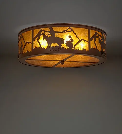 This stunning ceiling fixture features a Cowboy riding his horse across the mountainside. The fixture features an Amber Mica shade with a matching bottom diffuser. The fixture is offered with decorative accents and hardware finished in Rust. The Cowboy Flush Mount is included in our American-made; American-designed handcrafted Southwestern Lighting Collection and is manufactured in Yorkville; New York. The fixture is UL and cUL listed for dry and damp locations.