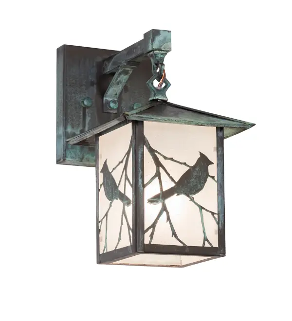 You can almost hear this singing bird's beautiful melodies echoing the rhythms of Mother Nature. Delicately etched in Solid Brass; the delicate songbird silhouettes perched on branches accentuate this charming wall sconce. The Solid Wall Sconce is finished in Verdigris and features a Frosted Seeded Glass diffuser. This left- oriented fixture complements the Stillwater Song Bird Left Wall Sconce; model 94177. These wall fixtures are perfect for illuminating indoor and outdoor spaces in timber homes; modern farmhouses; and other locations. The Stillwater Song Bird Wall Sconces are included in our American-made; American-designed; handcrafted Craftsman Signature Lighting Collection and manufactured in Yorkville; New York. UL and cUL listed for dry; damp; and wet locations. Our Build Your Own Craftsman Signature Series features unlimited combinations of styles. The collection is called Build Your Own because it is fully configurable and customizable from size and design to finish and lens color. Go wild with the options; or send us your own concept today! Call today to learn how to use the configuration tool available on our website for an instant item number!