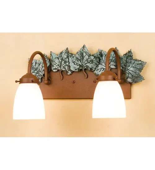 This handsome two light bath sconce features Green finished Maple Leaves on a Rust wall sconce. The fixture is hand made in the U.S.A. by Meyda craftsman and has White Opal goblet shaped shades.