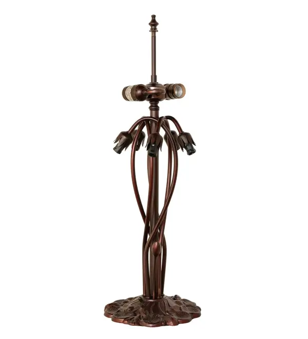 Recreating the famous Tiffany design from the early 1900s. This resplendent table lamp features five stunning shades created of Pink Favrile-style art glass and crowned with a beautiful shade featuring Dragonflies with glowing red eyes and delicate metal filigree wings circle over hand-cut and copper foiled pieces of Pond Green glass that represent rippling water. An elegant metal base with floral accents is finished by hand in Mahogany Bronze. This lamp is ideal for illuminating picture windows, dining areas, and living spaces in fine homes and hotels. The Dragonfly Tiffany Pond Lily Table Lamp is included in our American-designed, handcrafted Favrile Glass Lighting Collection. It is UL and cUL listed for dry locations. Each shade is a unique work of art with color variations based on natural ingredients inherent in the glass. Collection: Dragonfly Finish: Mahogany Bronze Glass: Stained Glass Width: 20.00" Height: 26.00" Length: 20.00" Weight: 16.00 lb Number of Bulbs: 2 Maximum Wattage: 60.00 W Bulb Type: A19 Bulb Base: E26 Material: Zinc/Steel Country of Origin: CHINA Safety Rating: Dry