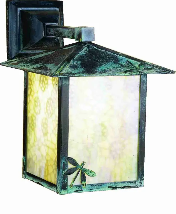 A charming Dragonfly darts across the edge of this handsome American Craftsman lantern style wall sconce. The fixture; handcrafted in the USA by Meyda artisans; is finished in Verdigris and has Iridized Beige art glass panels.