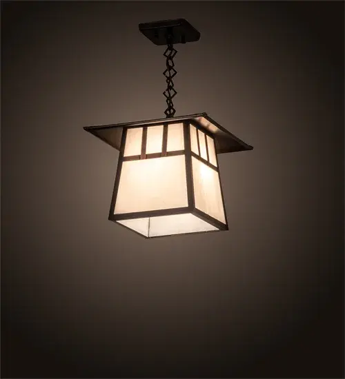 The Double Bar Mission has a pair Arts and Crafts style crossed bars that accent this handsome American Craftsman lantern style ceiling pendant. The fixture; handcrafted in the USA by Meyda artisans; is finished in Craftsman Brown and has White glass panels.