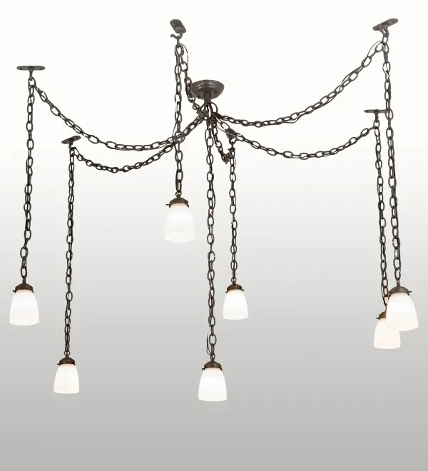 The elegant Castilian Pendant will grace any residential; hospitality or commercial space. Seven White Opalescent Glass shades are draped from chains above. The frame and hardware are finished in Timeless Bronze. The overall height and the overall width varies as the chain length can be easily adjusted in the field to accommodate your specific lighting application. Handmade in our 180;000 square foot manufacturing facility in Yorkville; NY. Available in custom sizes; finishes and styles. Dimmable energy efficient lamping options are offered. UL and cUL listed for dry and damp locations.