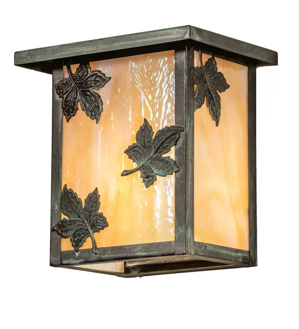 Falling Maple Leaves adorn this handsome American Craftsman lantern style wall sconce. The fixture; handcrafted in the USA by Meyda artisans; is finished in Verdigris and has Iridized Beige glass panels.
