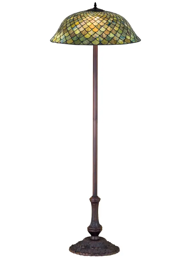 A Louis Comfort Tiffany studio classic fishscale pattern reproduced in variegated glass of Honey dripped Emerald; Sapphire; and Garnet. This handsome stained glass shade is used with a Mahogany Bronze hand finished lamp base. A versatile floor lamp to complement any color or style.