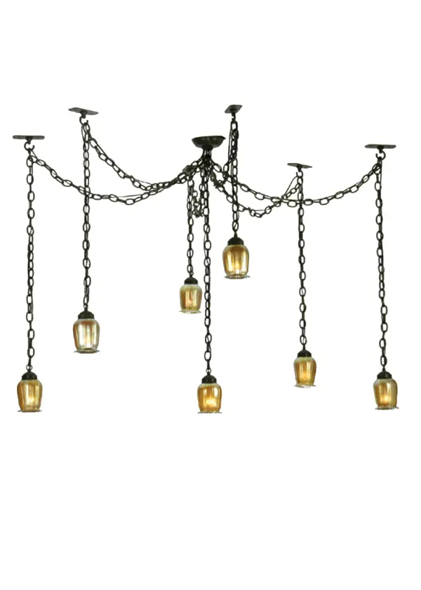 The 7 light Castilian pendant can be adjusted to varying widths and heights. The hardware is finished in Timeless Bronze and suspends squash shaped iridized Amber favrile shades.
