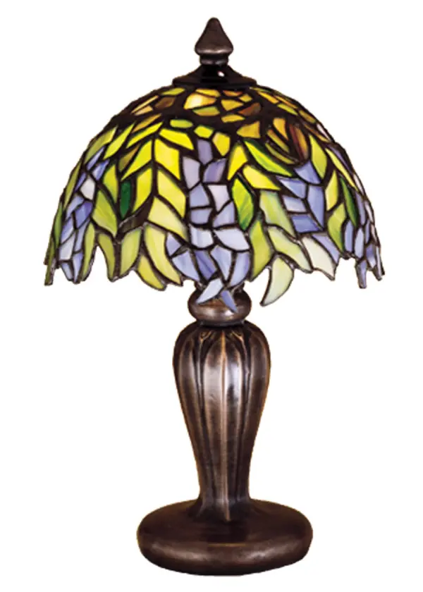 The Honey Locust was popular floral design created by Louis Comfort Tiffany; more than a century ago. Decorative dome-shaped stained glass lampshades; with petal shaped edges depict clusters of Plum and Periwinkle flowers amid Spring Green leaves cascading towards the base. This mini lamp has a complementary decorative base featuring our Mahogany Bronze finish.