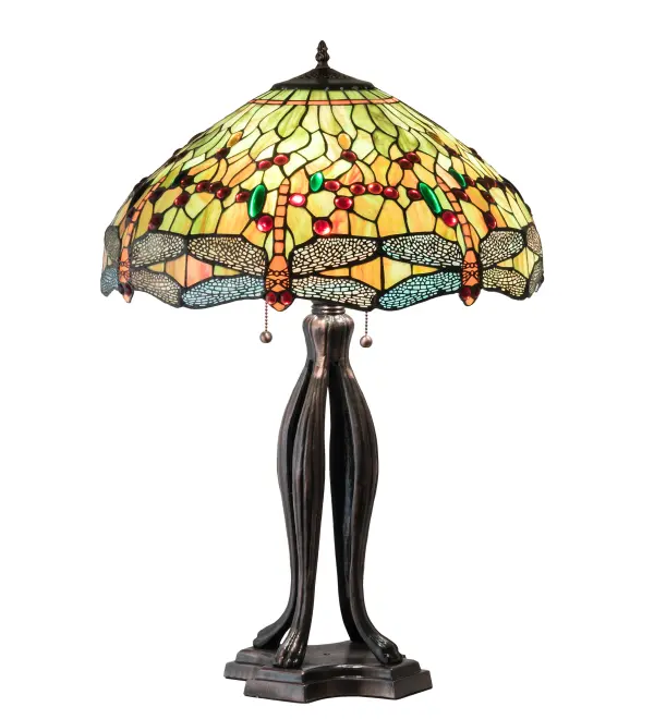 This version of Tiffany Studio's most beloved stained glass dragonfly design, is modeled after the original hanging head dragonfly. Diving dragonflies with glowing Scarlet jeweled eyes and delicate metal filigree wings circle over hand cut and copper foiled pieces of Amber, Pond Green and Scarlet art glass and glistening jewels of Amber, Emerald and Scarlet that represent sunset reflections on rippling water. The hardware is a warm hand finished Mahogany Bronze. Collection: Tiffany Hanginghead Dragonfly Finish: Mahogany Bronze Glass: 59 Oa Red Green 59R Width: 20.00" Height: 30.50" Length: 20.00" Weight: 19.00 lb Number of Bulbs: 3 Maximum Wattage: 60.00 W Bulb Type: A19 Bulb Base: E26 Material: Metal Or Polyresin Country of Origin: CHINA Safety Listing: Dry Safety Rating: Dry