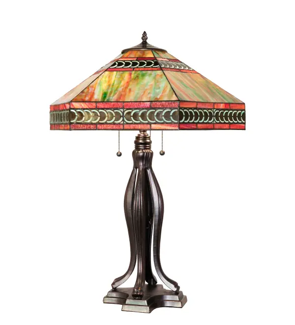 Inspired by Tiffany's famous Harvard design; The Cambridge Mission is handsome and versatile. The shade is bordered in a crescent filigree over Sky Blue with Amber rippled glass accents; and like a fire opal; vibrates with swirled jewel tones of Jade; Amber and touches of Ruby and Cobalt that are unique in every panel; and every light source. The table lamp is hand finished in Mahogany Bronze.
