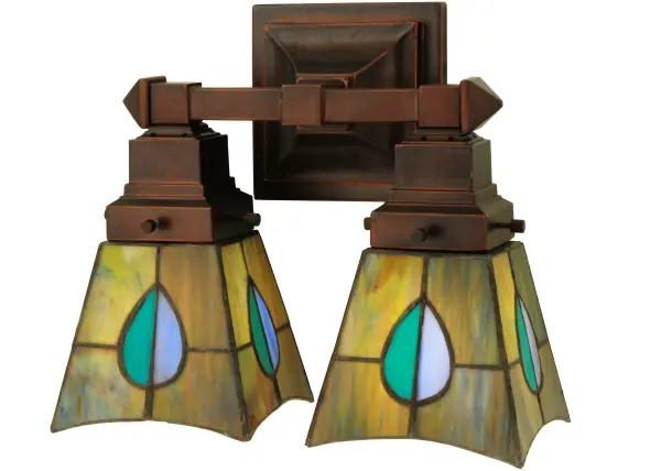 The Mackintosh Leaf stained two light wall sconce has Tiffany style shades in a striking leaf design of Heather; Purple; Highland Teal and Peacock Feather Green glass. The wall sconce was inspired by a famous design from Scottish Nouveau Artist Charles Rennie Mackintosh. It features a Mahogany Bronze finish.