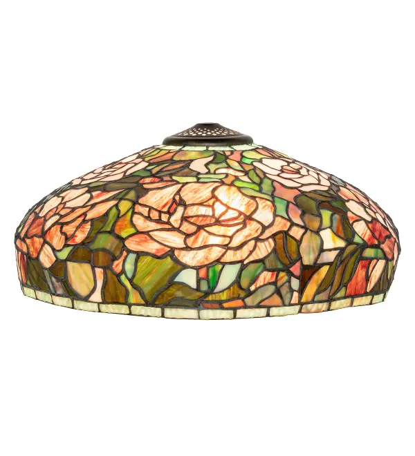 The Peony flower has inspired many Tiffany shades. This masterful re-creation is reminiscent of the glory of beautiful gardens from Portland; Maine; to Ann Arbor; Michigan; to Aimes; Iowa. Full blooms of Cinnabar Red and Pink Peonies are nestled in a halo of Spring Green leaves. This art glass shade is created using the famous Meyda Tiffany copperfoil construction technique and will bring the splendor of the garden into your home. Ideal for pairing with a base to create a charming table or floor lamp; or match with hardware to build an elegant ceiling fixture. The Tiffany Peony Table Lamp is included in our American designed; handcrafted Tiffany Reproduction Collection. Each shade is a unique work of art with color variations based on natural ingredients inherent in the glass. Contact us if color matching is critical when ordering multiple items.