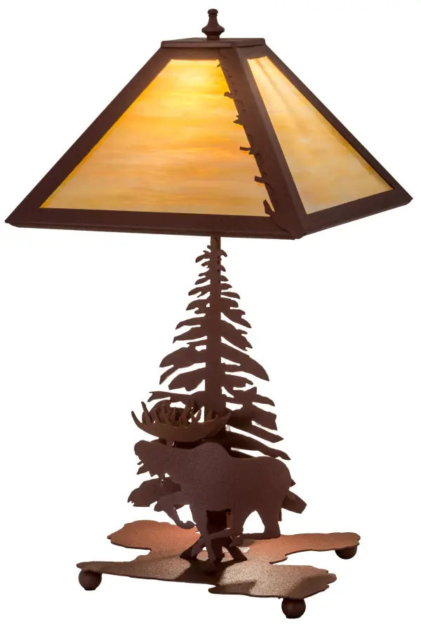 A linear square shade with a leaf edge sits above a lamp base that depicts a running Moose in front of a tall pine. The table lamp is finished in Natural Rust, has Beige art glass panels and is handcrafted in the USA by Meyda artisans. Collection: Moose On The Loose Finish: Rust Rust Glass: Beige Iridescent Glass Width: 16.00" Height: 21.00" Length: 11.50" Weight: 7.50 lb Extension from Wall: 5.00" Number of Bulbs: 1 Maximum Wattage: 60.00 W Bulb Type: A19 Bulb Base: E26 Material: Steel Country of Origin: USA Safety Listing: Dry Safety Rating: Dry